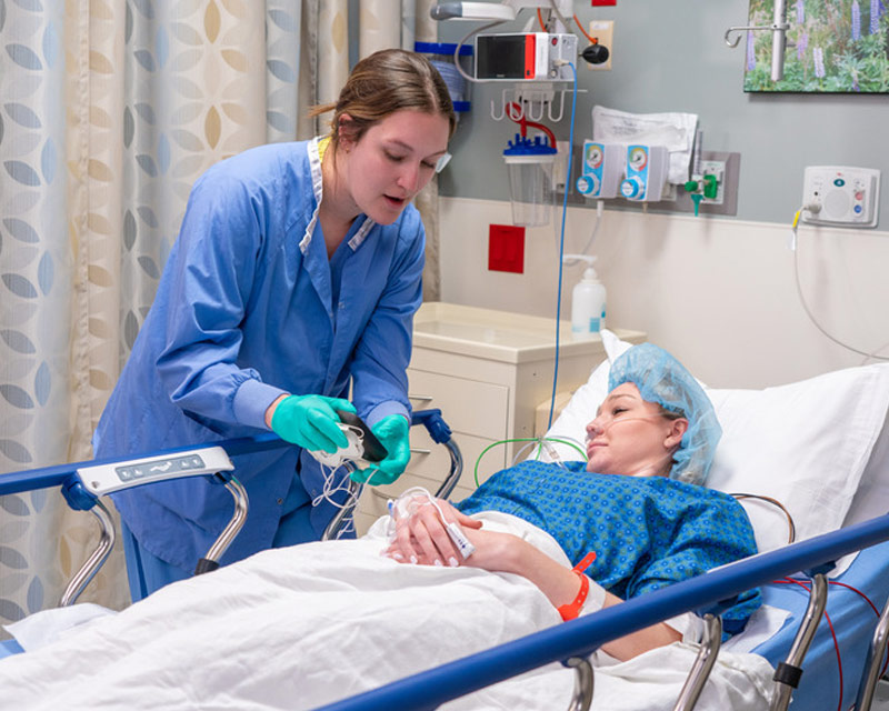 Nurse talking to patient.